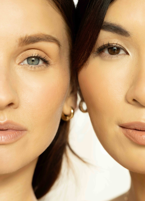 ultra close-up of two models' faces cheek-to-cheek