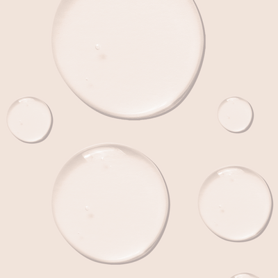 beige background with clear liquid bubbles