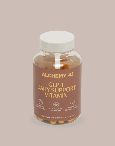 product bottle with tan label and gold text reading "Alchemy 43 GLP-1 daily support vitamin"