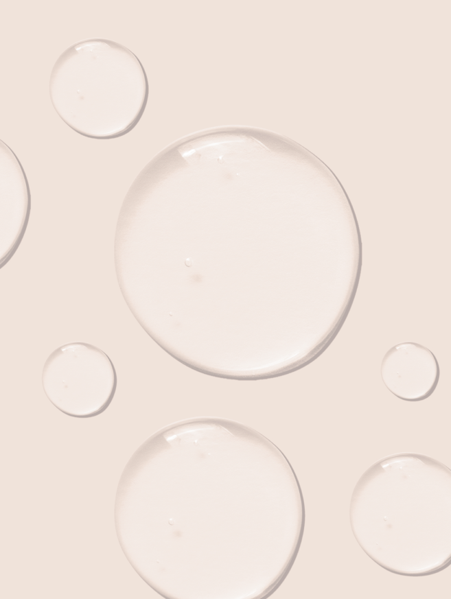 beige background with clear liquid bubbles