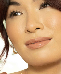 close up of smiling model with dark hair