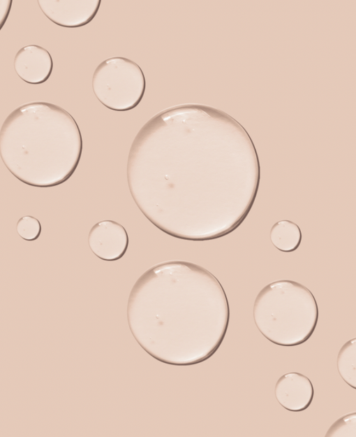 beige background with clear liquid bubbles